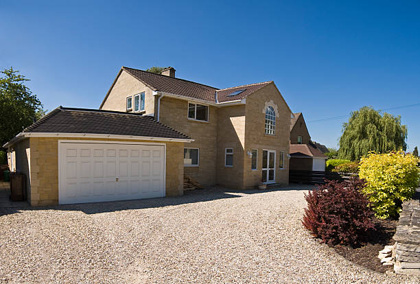 New build home in Columbus, gravel drive and clear blue sky on a perfect summers day.