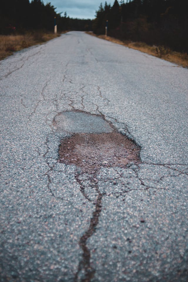 Worn asphalt area that may need patching