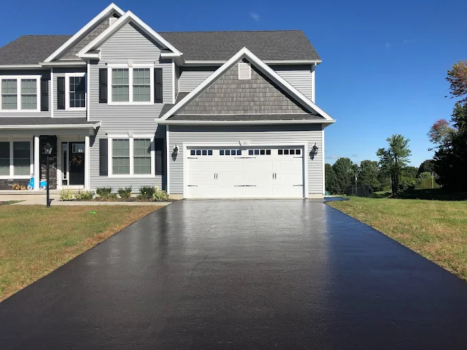 freshly sealcoated asphalt driveway